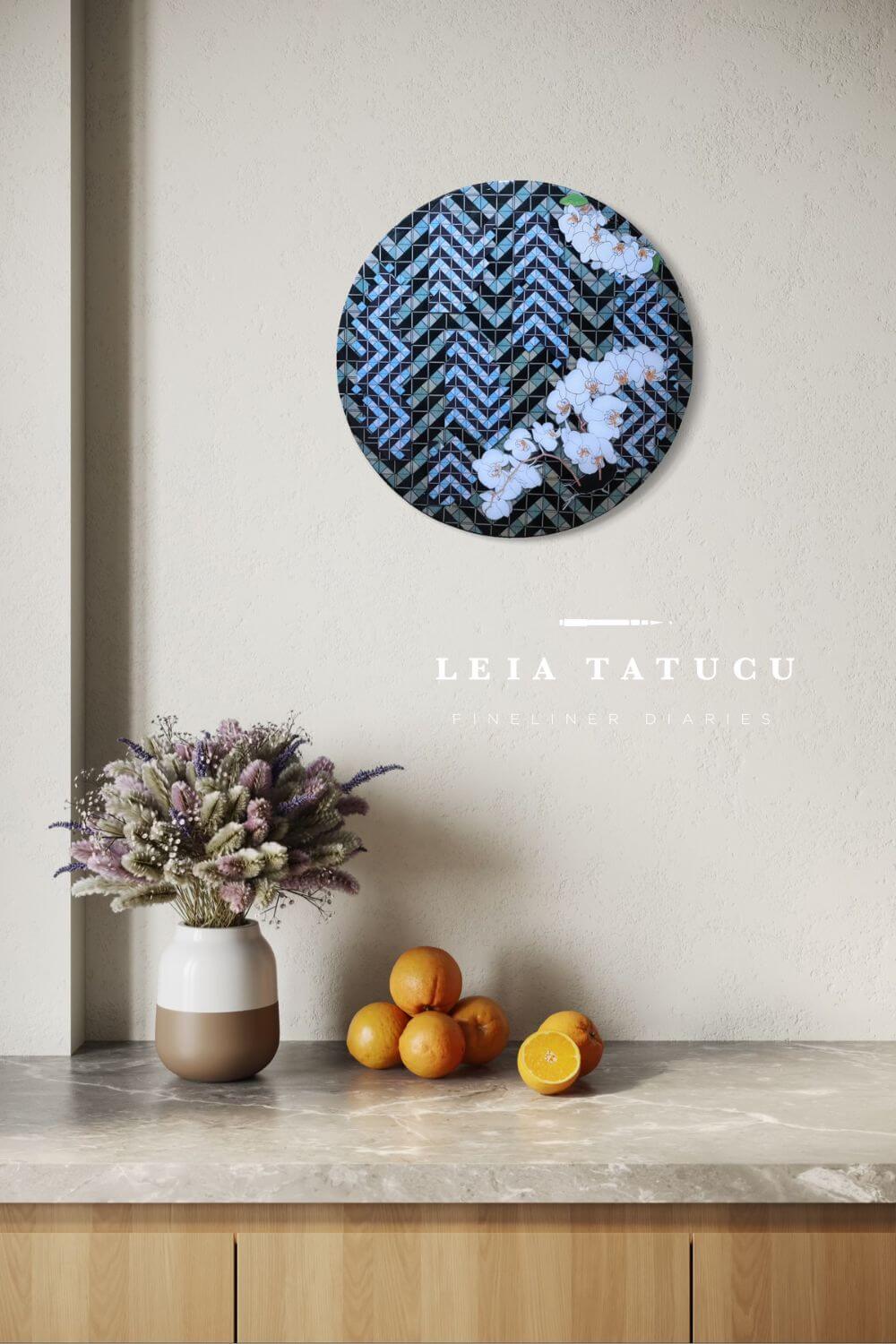 Decorative wall piece with floral pattern on a neutral wall, featuring the brand LEIA TATUCU.