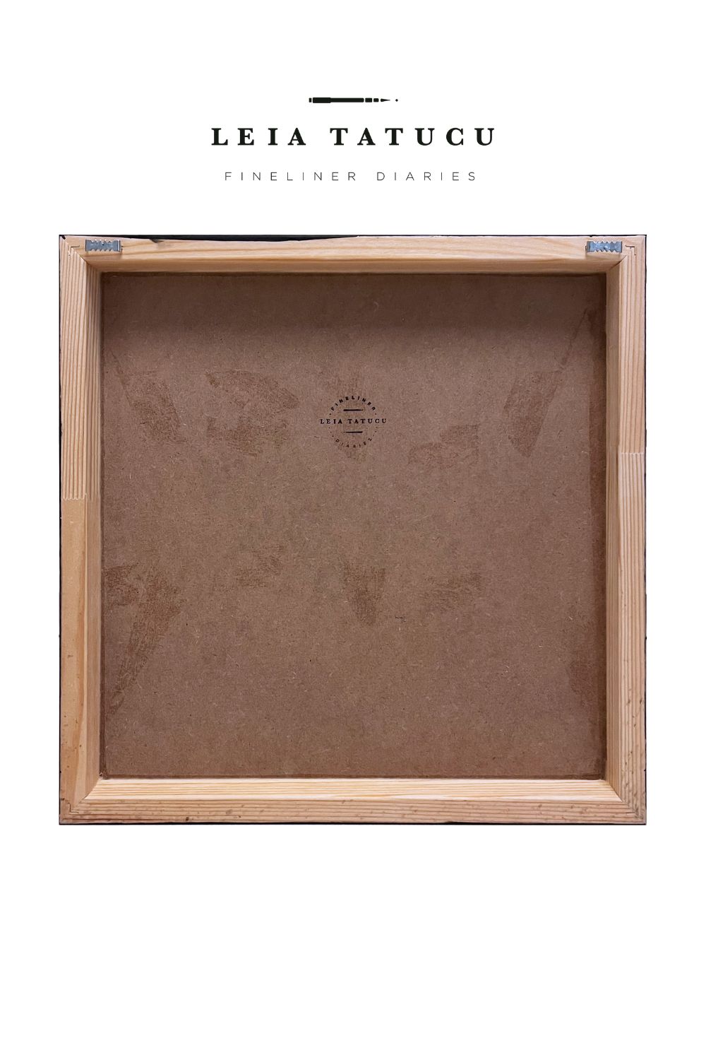 Back of a painting on a wooden panel, with hanging hooks and the artist's stamp logo.